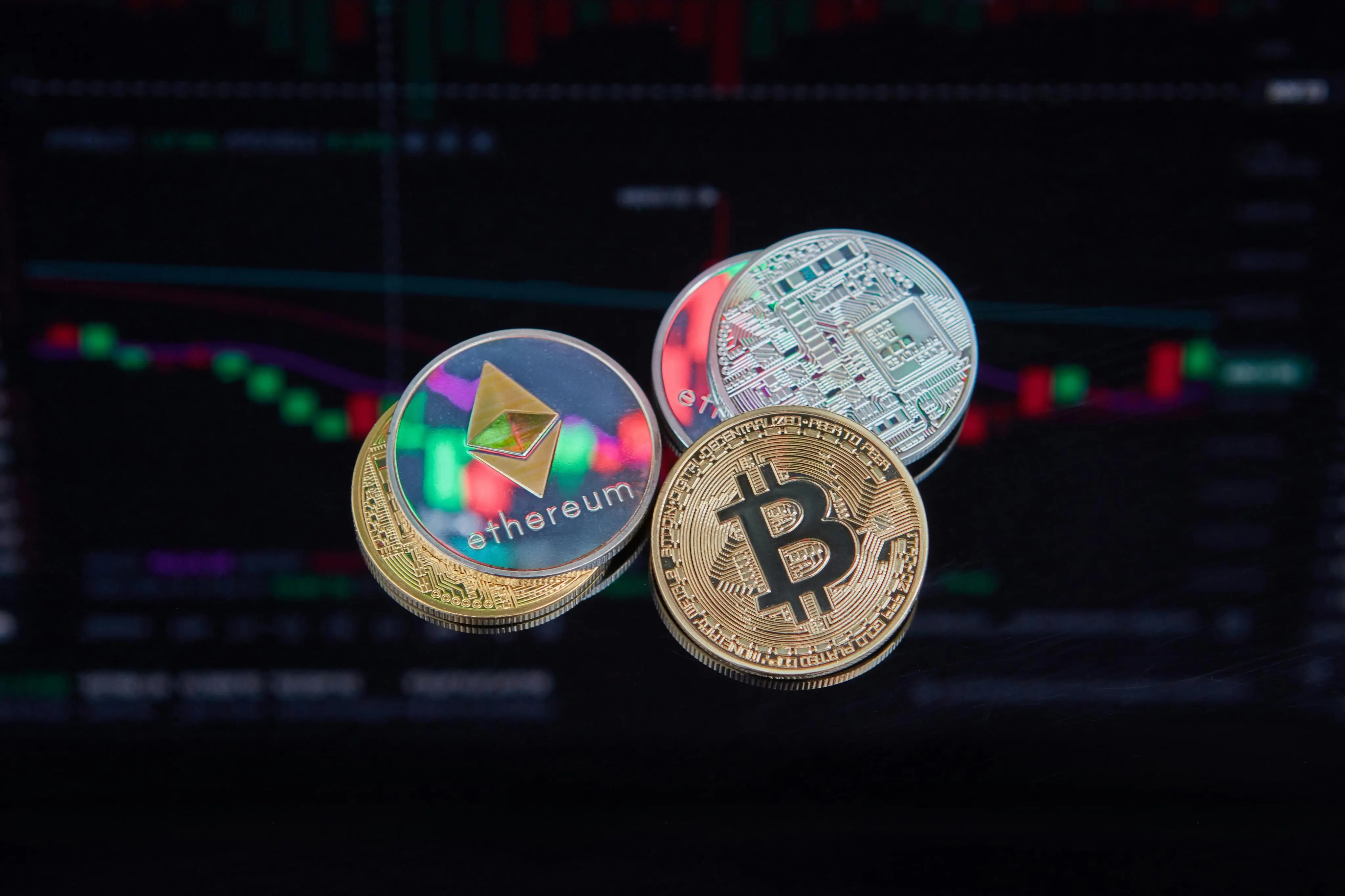 Bitcoin and Ethereum coins on a crypto trading market background